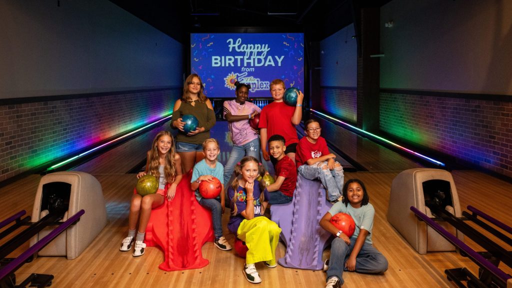 Image of group of kids posing at bowling lanes