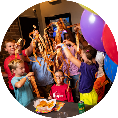 Group of kids at Funplex Party winning arcade tickets