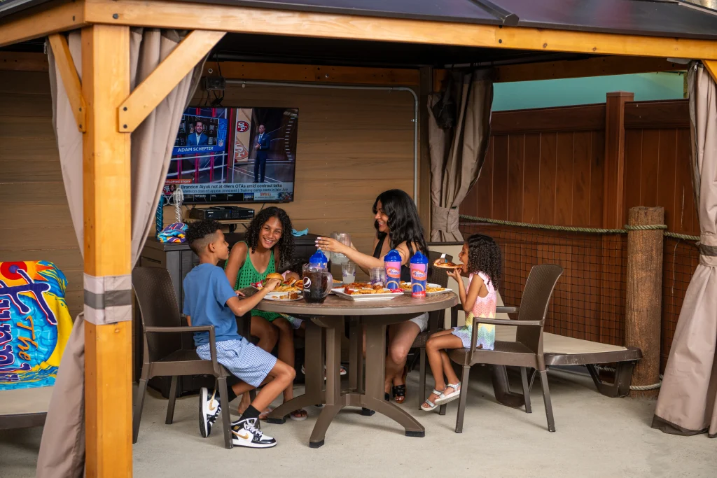 Image of a family enjoying a Villa at the Funplex waterpark